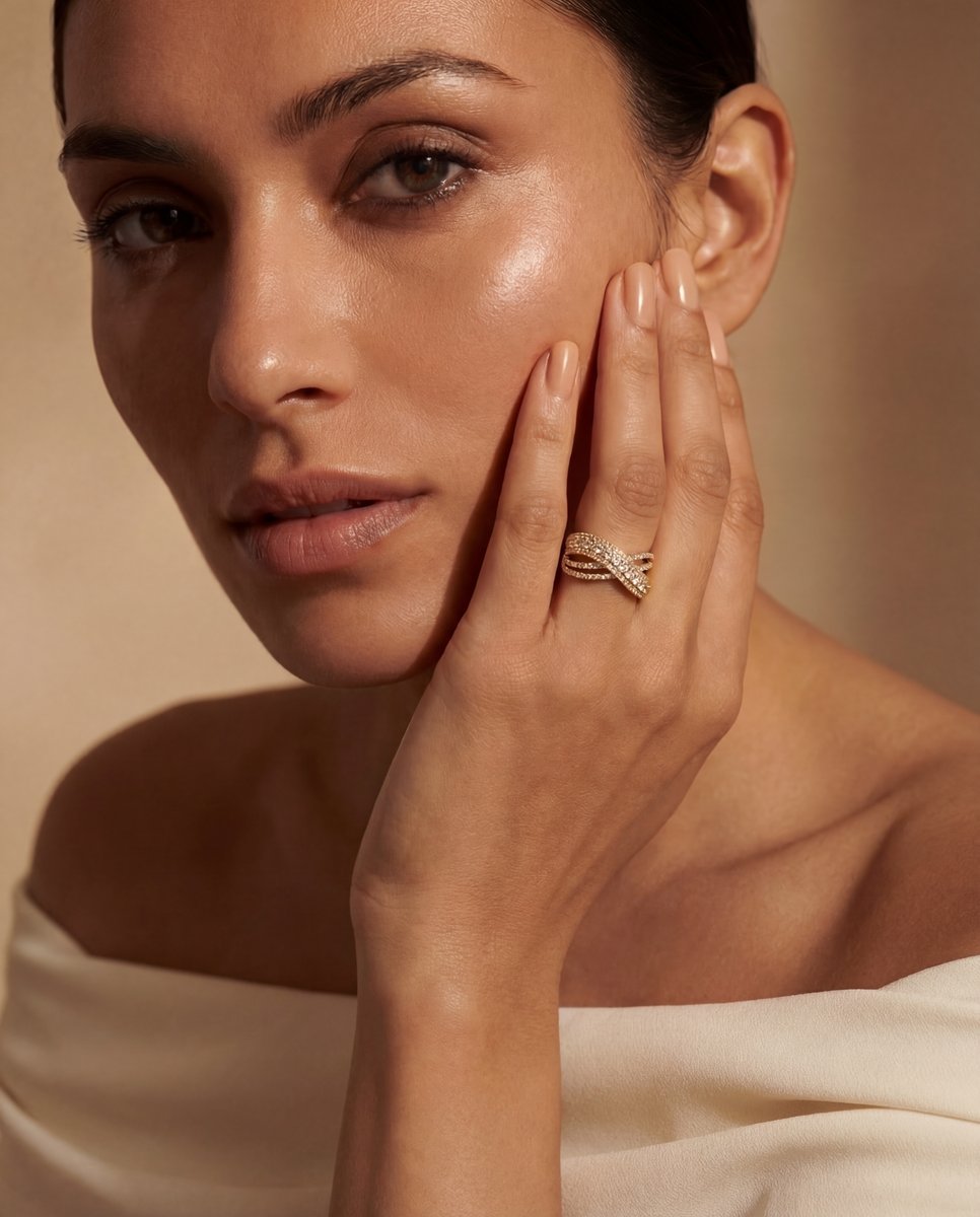 AI-generated ring photography — gold crossover ring with diamonds on model